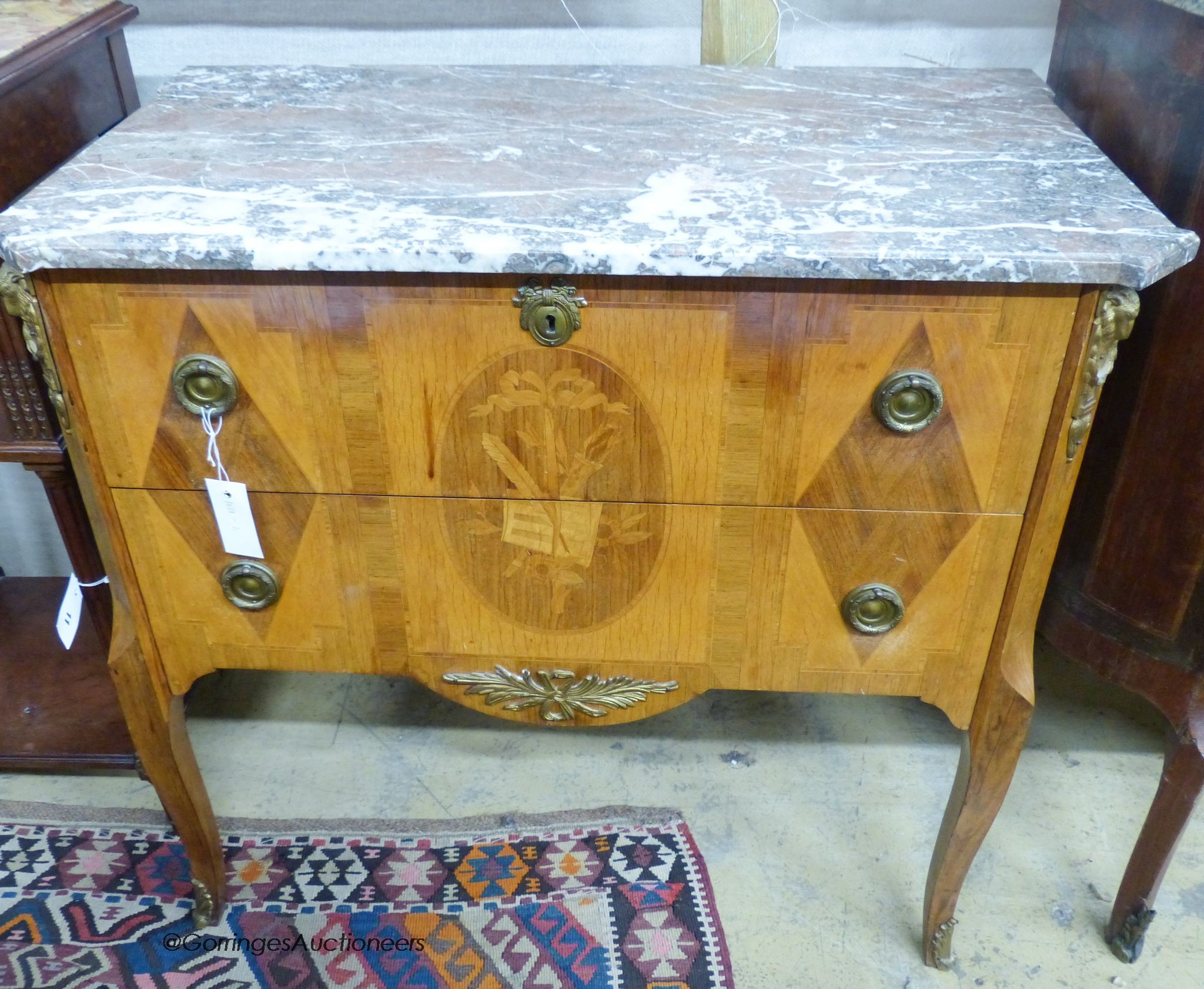 A French Louis XVI style marquetry inlaid marble topped commode, width 84cm, depth 47cm, height 78cm